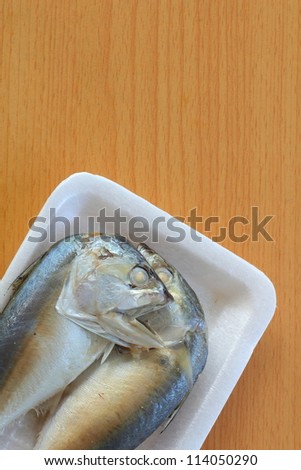 Steamed fish on wood background
