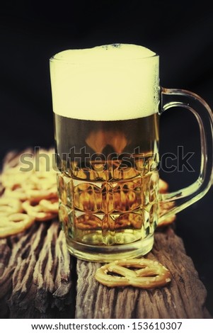Cookies pretzels and beer on the wood background