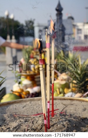 Incense sticks burning and in an altar at temple