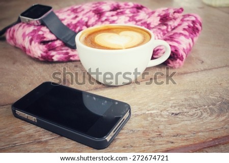 Latte coffee with smart phone and smart watch