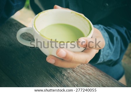 Drinking green tea and milk