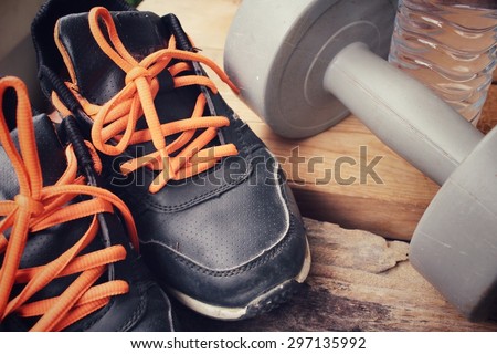Sports set of sneakers with dumbbell