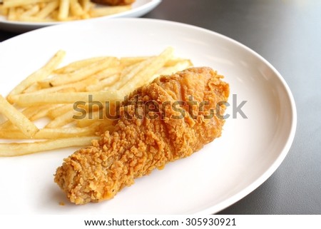 Fried chicken leg with french fries