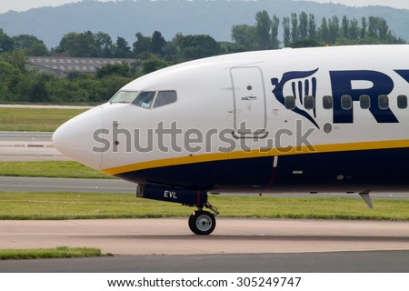 Manchester, United Kingdom - June 14, 2014: Ryanair Boeing 737 at Manchester International Airport. On August 2015, Ryanair is having talks with IAG and other carriers about long haul transfers.