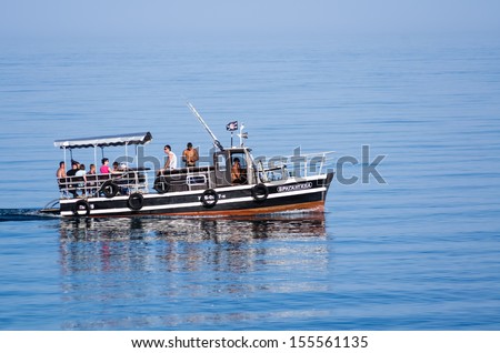 ALUSHTA, UKRAINE - JUNE 10: Boat trip along the coast on June 10, 2013. Boat trip along the coast is a favorite holiday entertainment in Alushta.