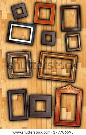 old painting wooden frames on wall backdrop
