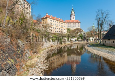 Castle with the famous round tower in Cesky Krumlov, Czech Republic is reflecting in the river Vltava
