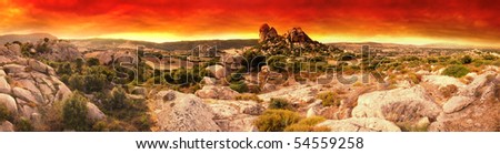 Beautiful sunset over the Moon Valley rock formations. Sardinia, Italy. Panoramic picture