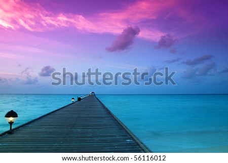 Beautiful sunrise over the sea and jetty in the Maldives, Indian Ocean