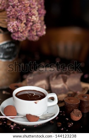 piece of chocolate bar with hot chocolate drink