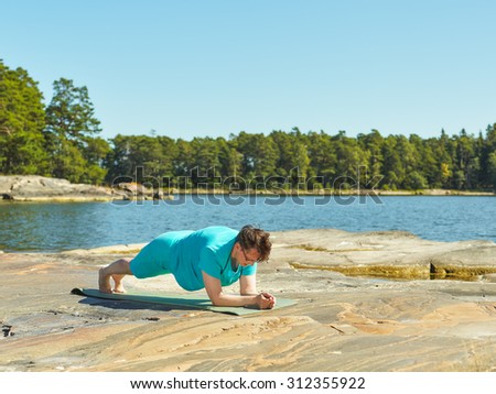 Real-life fitness training, mature woman training outdoor - horizon format image