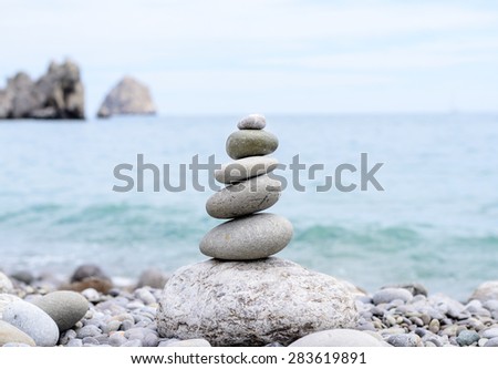 Close up Conceptual Piled Stones with Different Sizes at the Beach, Emphasizing Perfect Balance