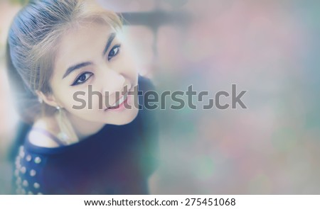 woman Asia Smile beautiful teeth skin From top view Bokeh:teenager gold-brown hair ,make up eye-liner and other ,wearing black T-shirt ,expression so friendly ,bokeh blank for
