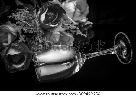 Pair glass of wine dinner sweet in love have black and white silver flowers background.