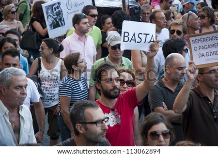 PORTO, PORTUGAL - SEPTEMBER 15: People protesting against government spending cuts and tax rises in Aliados square, Porto on September 15, 2012.