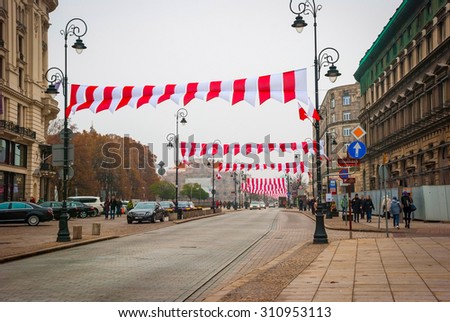 WARSAW, POLAND - NOVEMBER 10: Street in Warsaw decorated with polish flags before Polish national day on November 10, 2014