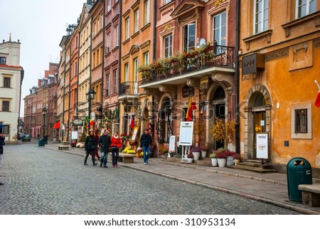 WARSAW, POLAND - NOVEMBER 10: Warsaw old town with restaurants and people walking. Taken on November 10, 2014