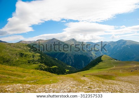 View over green hills and mountains of Pyrenees, Spain
