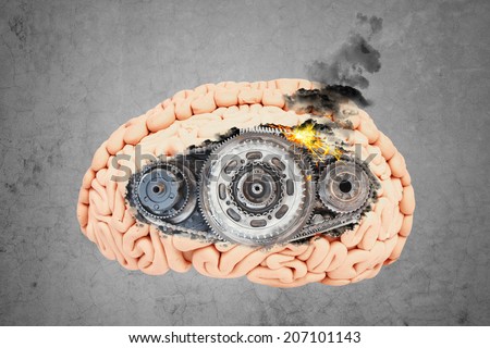 concept of stress with gear in the head of a brain on concrete wall