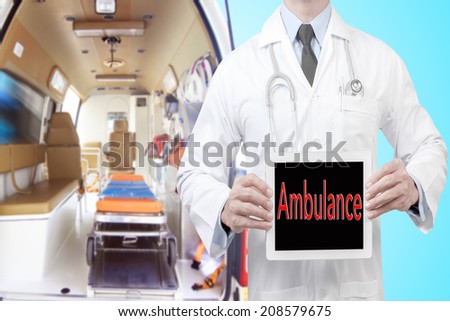 doctor presenting ambulance word in digital tablet screen against Inside of an ambulance for the hospital