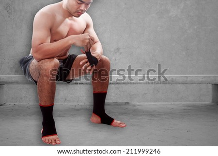 boxer wearing black strap on wrist