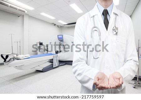 doctors holding something for presenting at computed tomography or computed axial tomography scan machine in hospital room