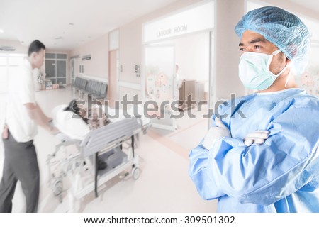 Surgeon cross arm action and medical active staff pushing stretcher gurney bed in labour room of hospital corridor with female patient pregnant in emergency status