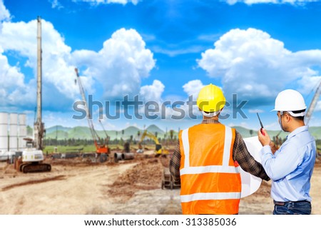 Engineer and foreman use radio communication for command working at construction site project