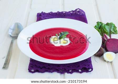 Cold summer Beets soup in the white plate on the white background