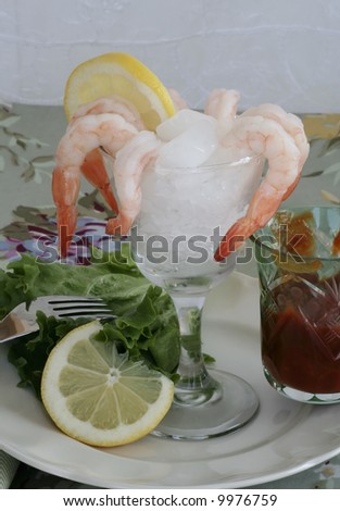 Shrimp cocktail with lemon and sauce