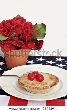 Pie with cherries on top with flag place mat