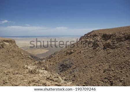 view of the desert and red sea from top of a mountian