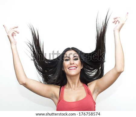 Beautiful woman with her hair in to wind on white background