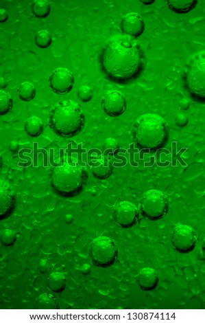Air green bubbles in water, the process beginning formation bubbles of crystals, extreme closeup. Macro