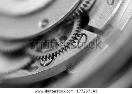 Black white Metallic Background with metal cogwheels a clockwork. Macro