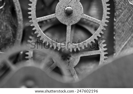 Black and white background with metal cogwheels inside clockwork. Conceptual photo for your successful business design. Macro.