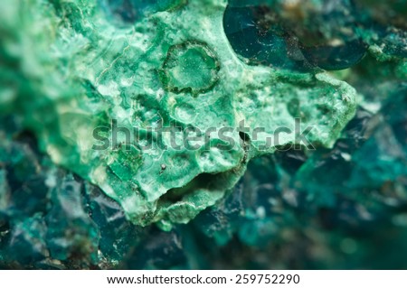 Chrysocolla is a hydrated copper cyclosilicate It has the chemical formula (Cu,Al)2H2Si2O5(OH)4nH2O.Cyan (blue-green) crystal. Macro. Beautiful fantastic background for successful Your projects