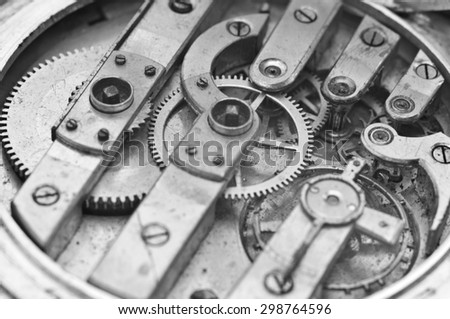 Black and White Metal Cogwheels Inside Oldest Clockwork. Conceptual photo for your successful business design. Macro