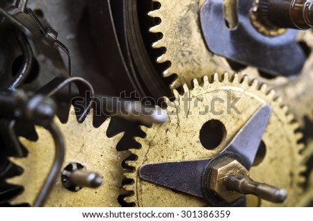 Metal Cogwheels Inside Old Clockwork to success concept for your technology design. Macro