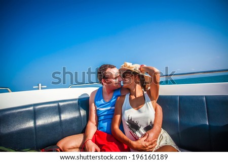 Couple in Love kissing on a sailing Boat in the Sea. Thailand