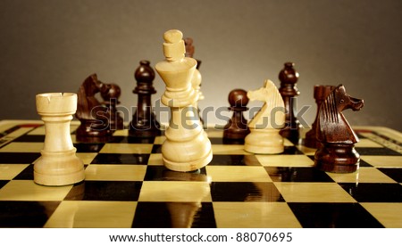 A game of chess comes to an end. The king is checkmated
