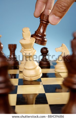 A game of chess comes to an end. The king is checkmated