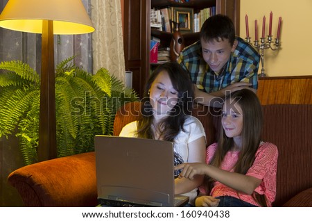 home still life, children watch the laptop in the living room at evening