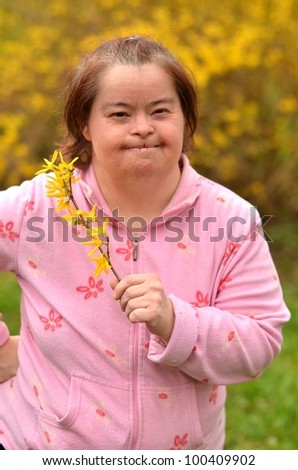 down syndrome woman with golden rain flowers