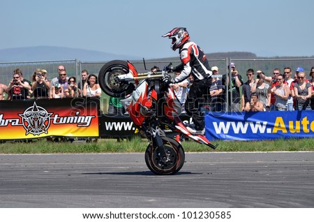 BOLKOVCE, SLOVAKIA - APRIL 28: Angyal ZoltÃ?Â¡n from Stunt show - Hungary performs stunt using motorcycle during the MAD POWER FEST, on April 28, 2012 in Bolkovce, Slovakia
