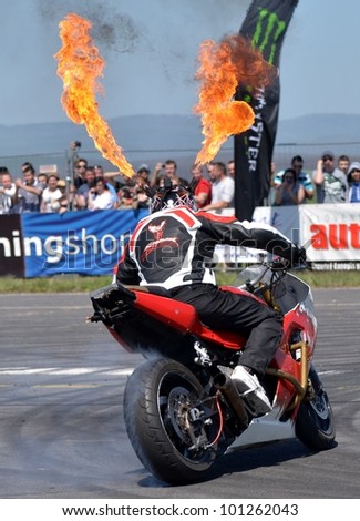 BOLKOVCE, SLOVAKIA - APRIL 28: Angyal Zoltan from Stunt show - Hungary performs stunt using motorcycle during the MAD POWER FEST, on April 28, 2012 in Bolkovce, Slovakia