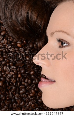 young pretty woman with coffee beans