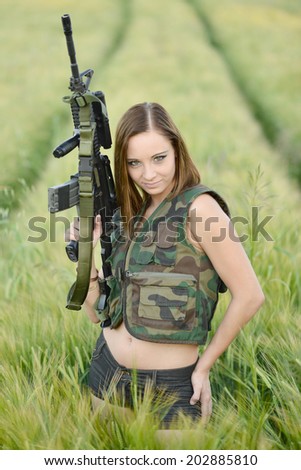 sexy woman holding up her weapon