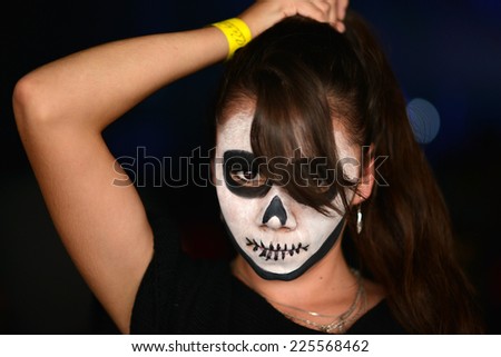 woman in day of the dead mask skull face art. Halloween face art.