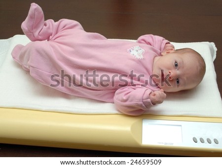 baby on  child weighing machine